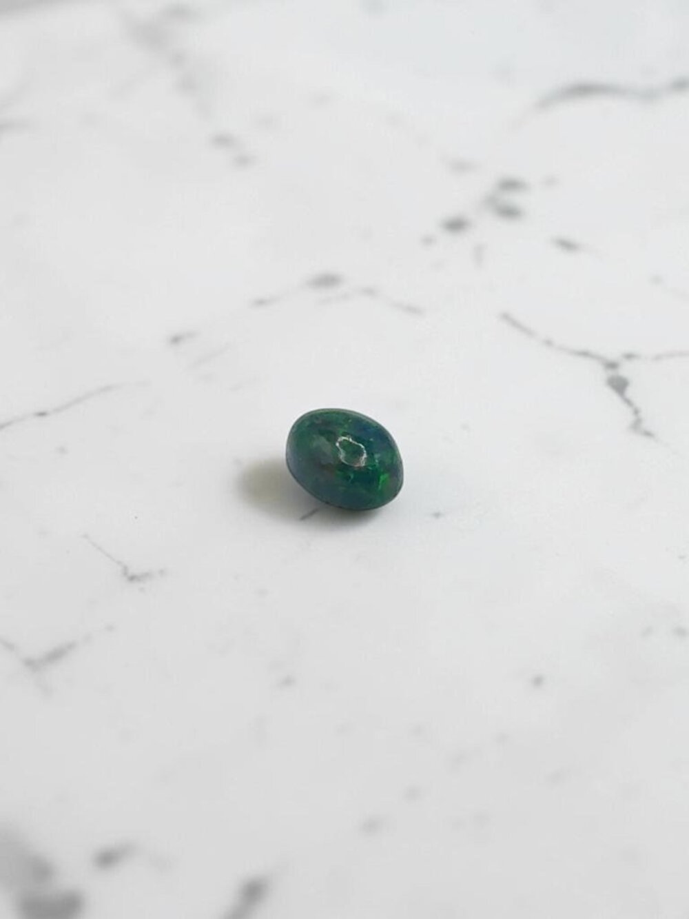 0.66 Carat Oval Cabochon Black Ethiopian Opal Gemstone